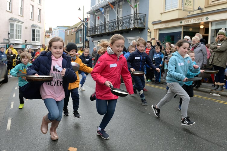 pancake race for RNLI in Tenby