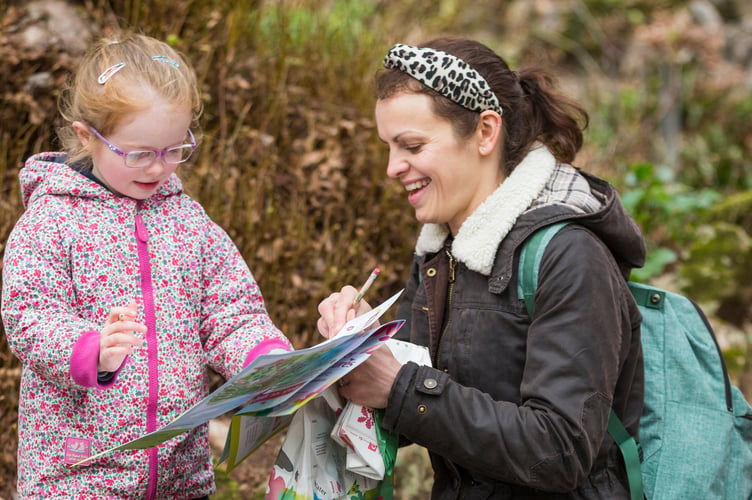 Families enjoy the Easter trail at Colby Woodland Garden