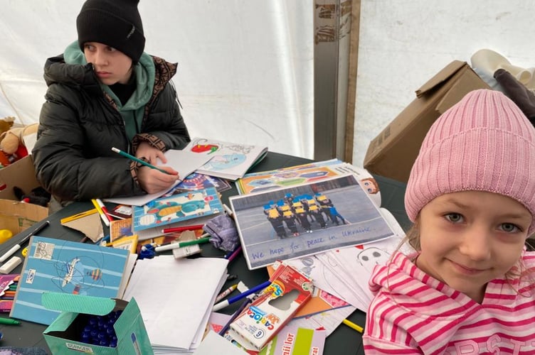 Refugee children at the aid drop-off