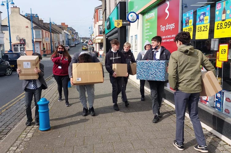 Greenhill School boys dropping off parcels for Ukraine