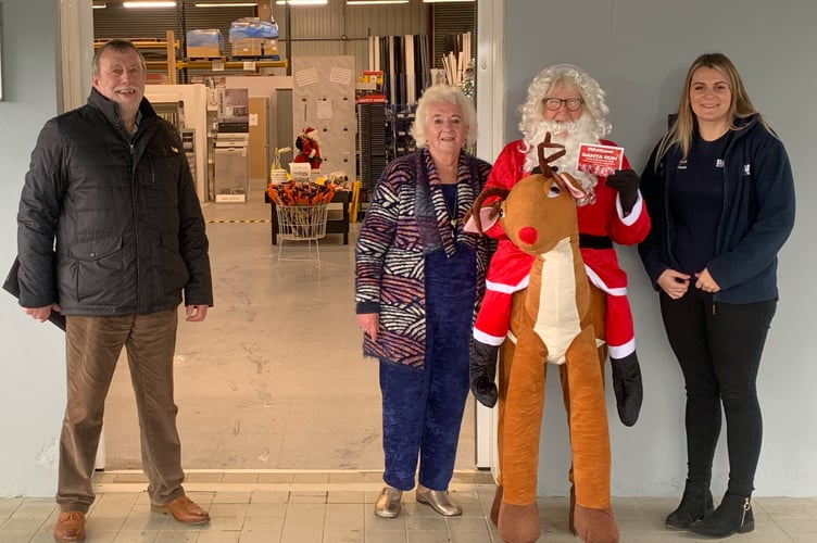 At Davies Builders Merchants, Mrs De Banks and office member Caroline met Santa.