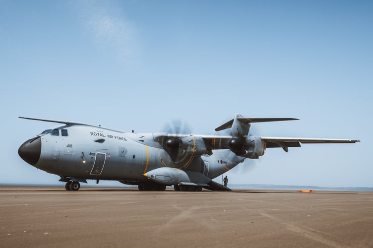 See SWNS story SWNAbeach. How's this for a day at the beach? Huge military transport planes have been spotted landing on Pembrey Sands in West Wales. The RAF Atlas A400Ms have been carrying out beach landing training at the coastal spot this week. They also practiced the insertion of so-called pathfinders, specialised soldiers dropped into place in order to set up and operate drop zones. Incredible pictures show the crews of the Brize Norton-based LXX and 30 Squadrons carrying out the objectives.