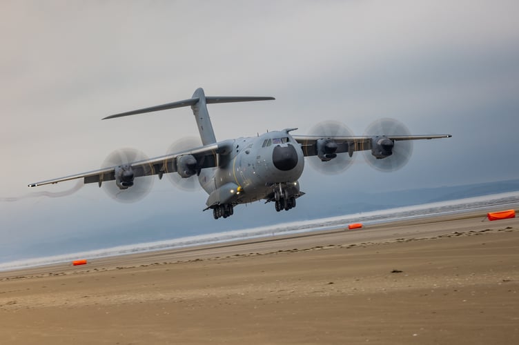 See SWNS story SWNAbeach. How's this for a day at the beach? Huge military transport planes have been spotted landing on Pembrey Sands in West Wales. The RAF Atlas A400Ms have been carrying out beach landing training at the coastal spot this week. They also practiced the insertion of so-called pathfinders, specialised soldiers dropped into place in order to set up and operate drop zones. Incredible pictures show the crews of the Brize Norton-based LXX and 30 Squadrons carrying out the objectives.