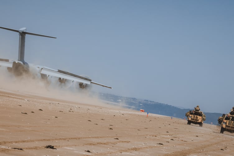 See SWNS story SWNAbeach. How's this for a day at the beach? Huge military transport planes have been spotted landing on Pembrey Sands in West Wales. The RAF Atlas A400Ms have been carrying out beach landing training at the coastal spot this week. They also practiced the insertion of so-called pathfinders, specialised soldiers dropped into place in order to set up and operate drop zones. Incredible pictures show the crews of the Brize Norton-based LXX and 30 Squadrons carrying out the objectives.