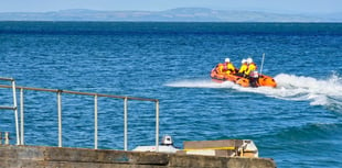 Tenby RNLI rescue five cut-off by tide on North Beach