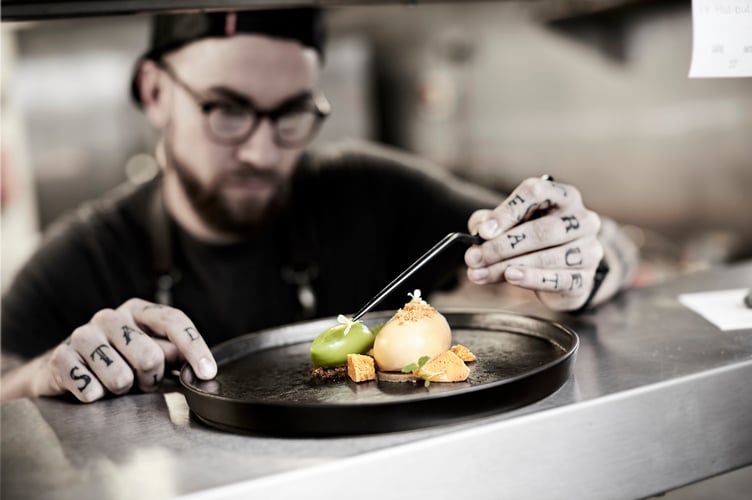 Head Chef Sammy Owen plating up at Twr y Felin