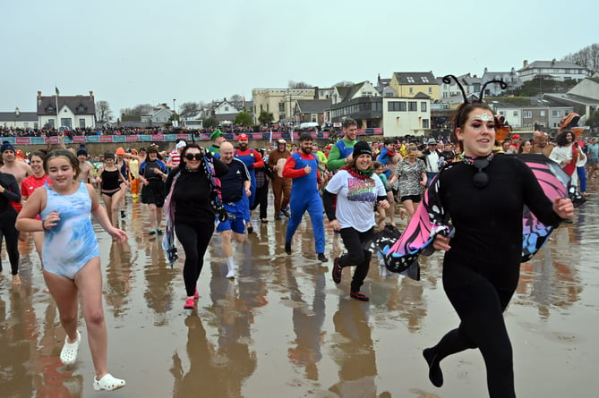 Entrants heading to the shoreline at the 2024 New Year's Day Swim in Saundersfoot