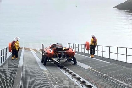 RNLI crew assist injured coasteerer
