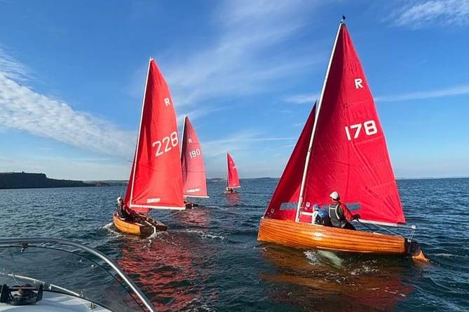 Four Redwing dinghies taking part in the summer series