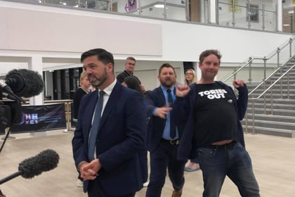 Conservative Stephen Crabb photobombed by ‘Tories out’ activist