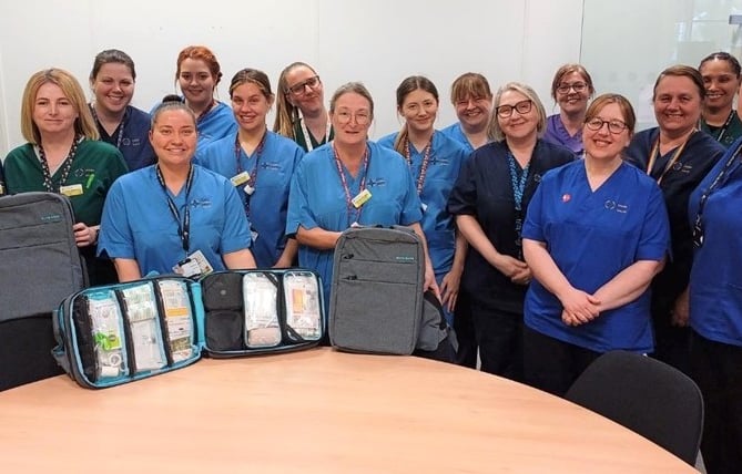 Members of the community nurse team with the new bags.