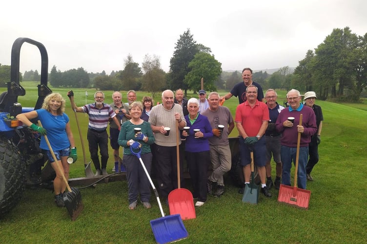 Trefloyne members enjoy a coffee after finishing the work