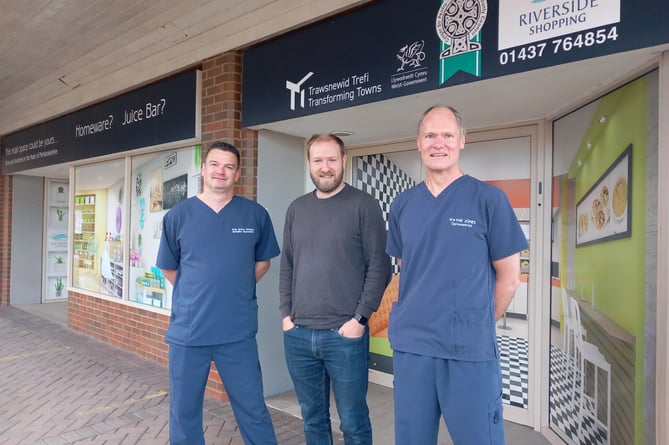 Looking to the future: Cllr Paul Miller, Deputy Leader of Pembrokeshire County Council (centre) with Andy Britton (left) and fellow partner Wayne Jones at the Riverside store which will be home to an expanded Specsavers.