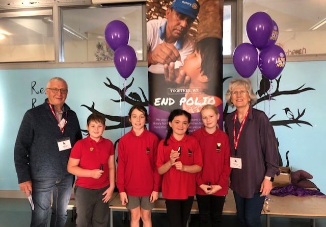 Rotarians Nigel Towns and Elaine Bradbury with children at Narberth CP School