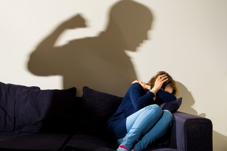 PICTURE POSED BY MODEL File photo dated 09/03/15 of a shadow of a man with a clenched fist as a woman cowers in the corner, as almost 100 domestic abuse incidents were reported to police on Christmas Day last year.